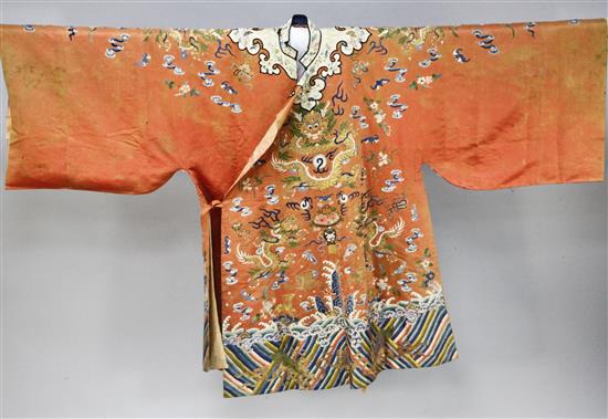 A Chinese apricot satin embroidered silk and metal thread dragon robe, late 19th century,